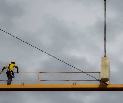 man-stand-on-crane