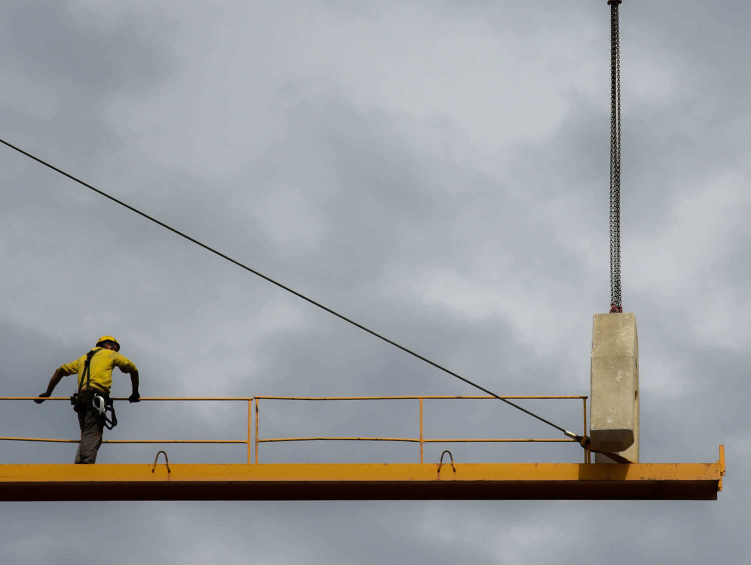 man-stand-on-crane